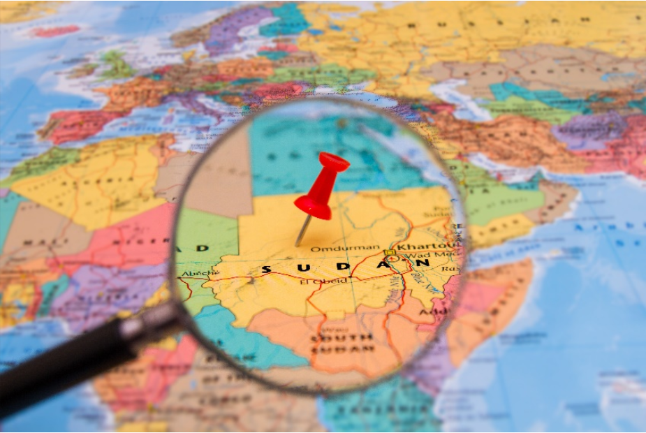 Sudan Map Photo of map of Sudan with magnifying glass and red pin